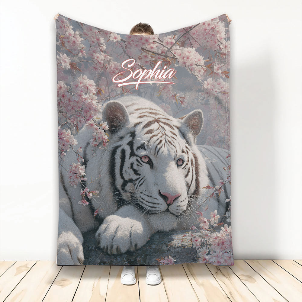 White tiger throw blanket with pink blossoms and a soft blue-gray floral background