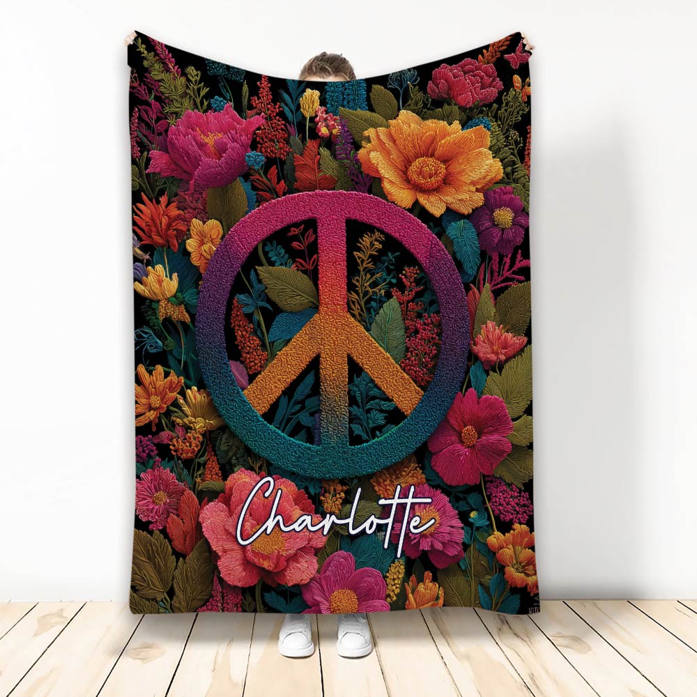 Hippie blanket with colorful floral artwork and a large rainbow peace symbol