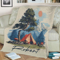 Close view of camping blanket artwork featuring a mountain, evergreen trees, red tent and sunny outdoor scene