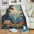 Camping throw blanket displayed on a sofa with mountain, forest, tent, and campfire artwork