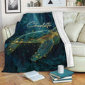 Sea turtle throw blanket displayed on a sofa with deep teal botanical and starry artwork