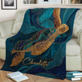 Detailed sea turtle throw blanket styled across a sofa with blue ocean-inspired artwork