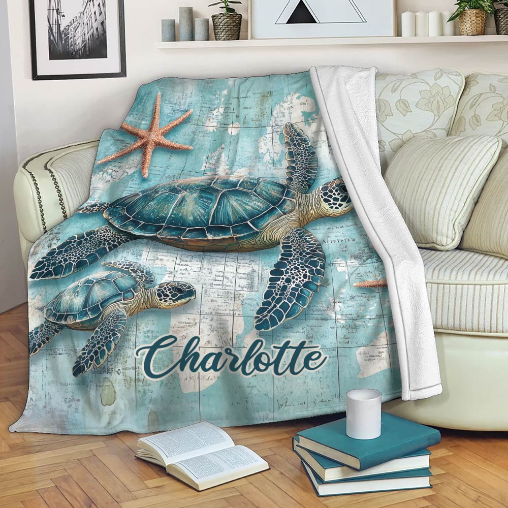 Sea turtle throw blanket draped over a sofa in a bright coastal living room