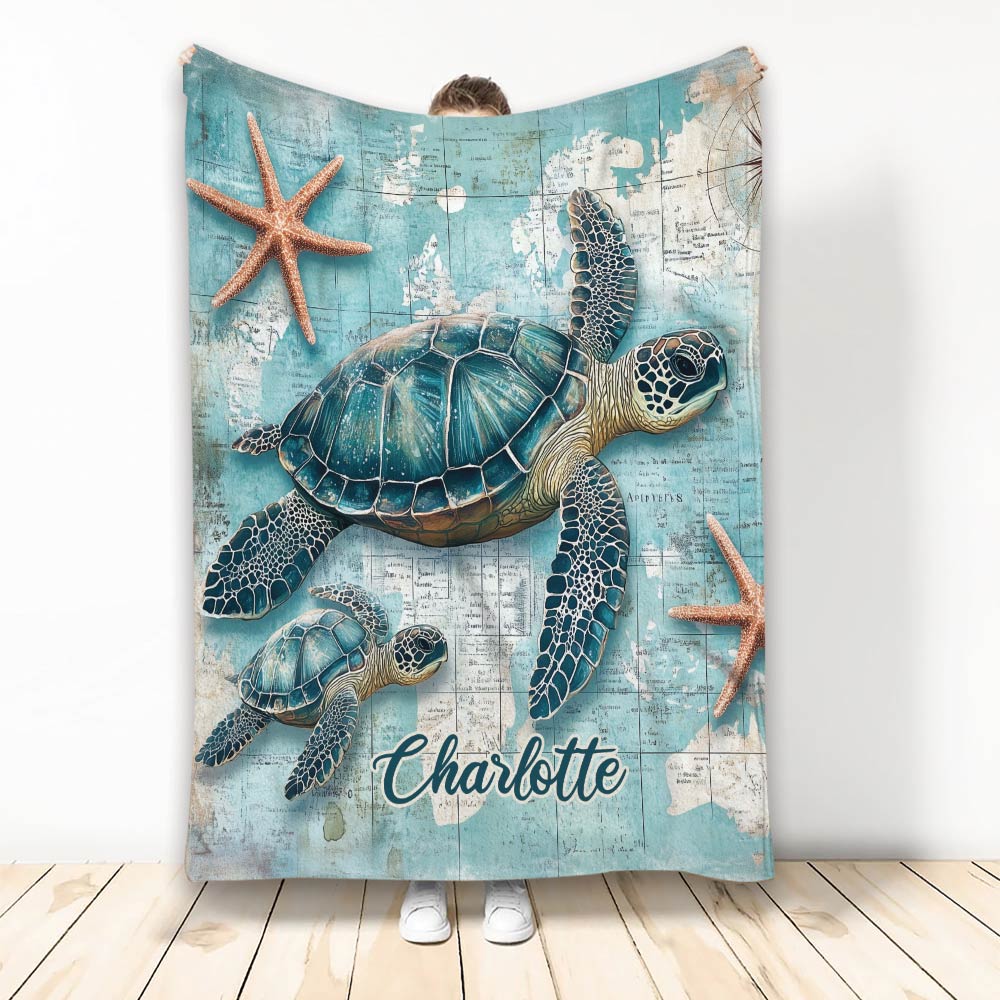Custom turtle blanket displayed upright with sea turtle and starfish coastal artwork