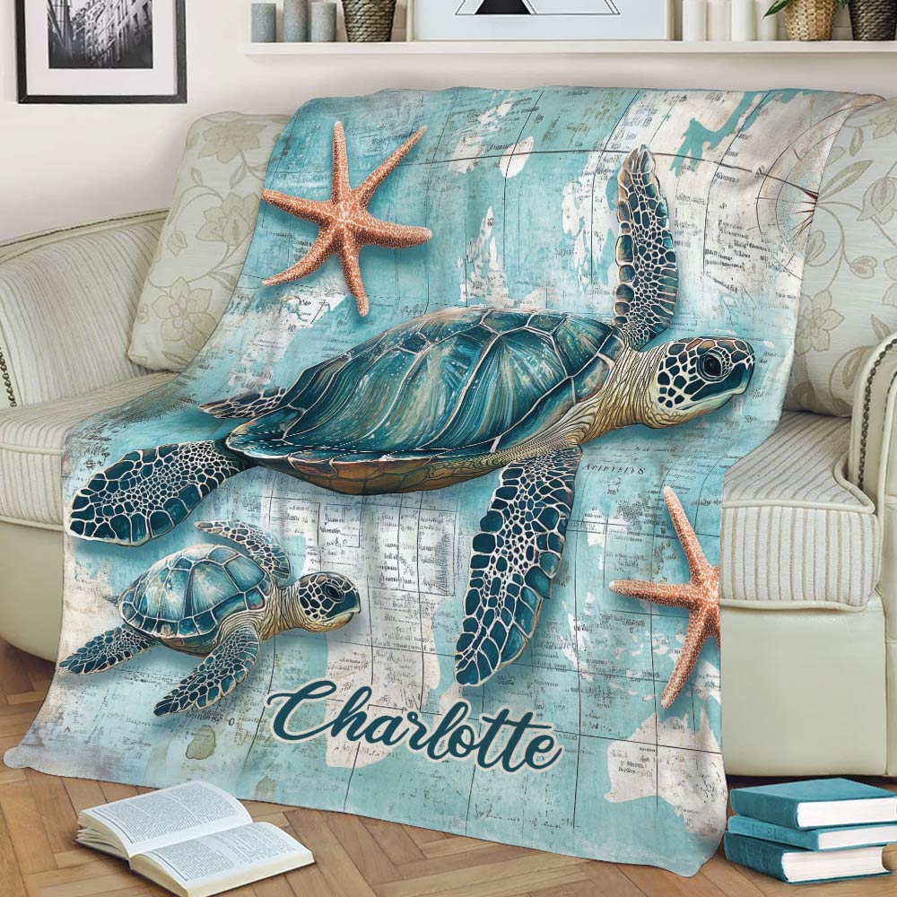 Close view of turtle throw blanket with ocean map artwork and starfish accents