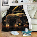 Elephant throw blanket with ornate gold artwork displayed on a living room couch