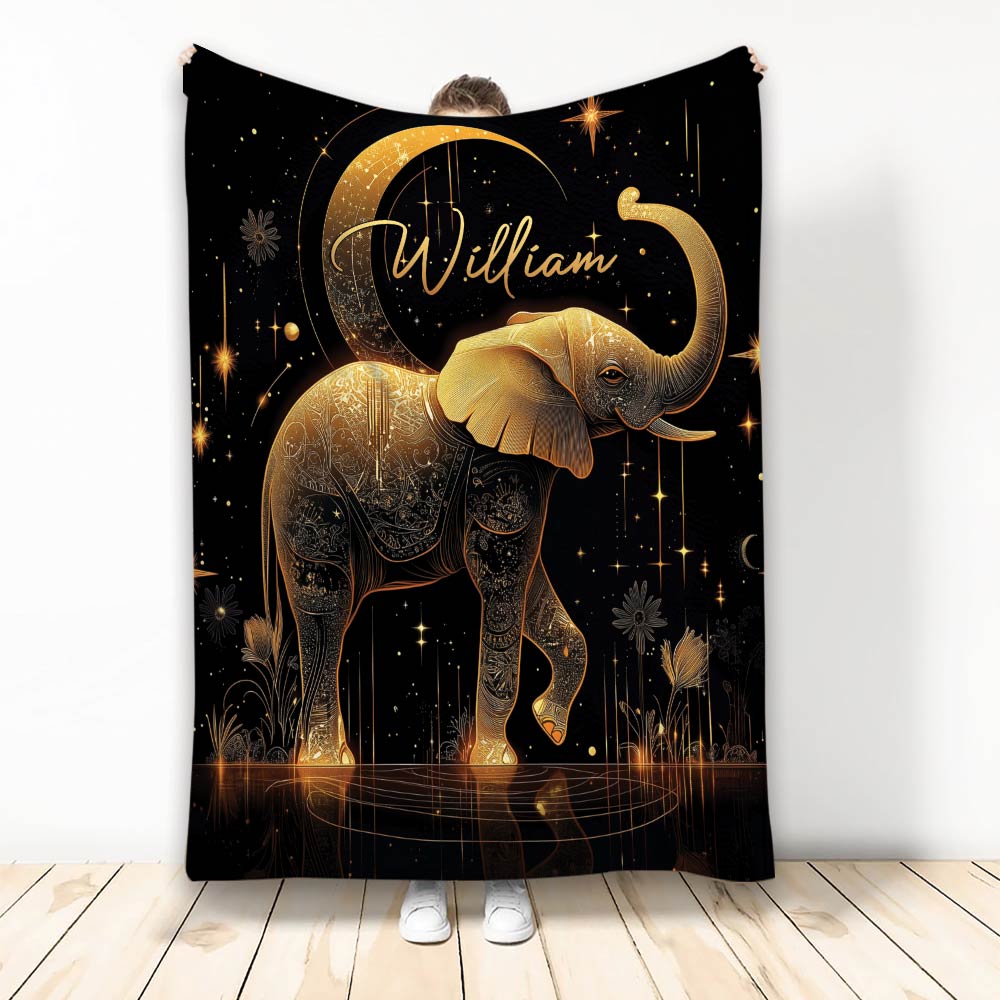 Gold elephant throw blanket with celestial stars, crescent moon, floral details, and black background