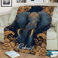 Close view of an ornate blue elephant throw blanket with golden flowers styled on a sofa