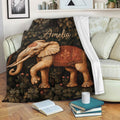 Elephant blanket draped over a sofa, featuring detailed vintage artwork and a leafy botanical background