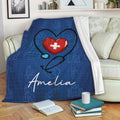 Blue nurse throw blanket displayed on a sofa with a stethoscope heart design and medical artwork