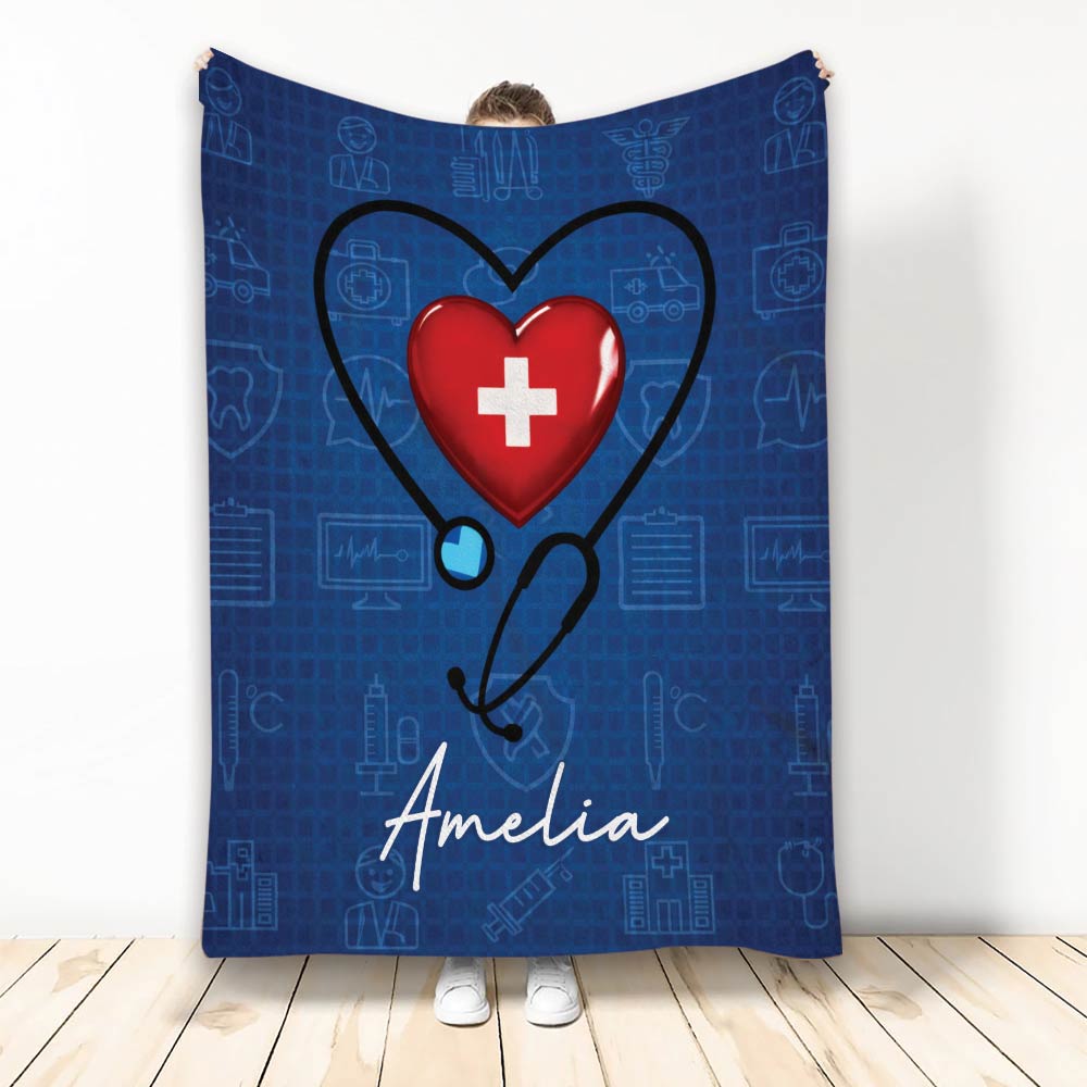 Nurse throw blanket with a stethoscope heart design, blue medical symbols, and a bold red heart