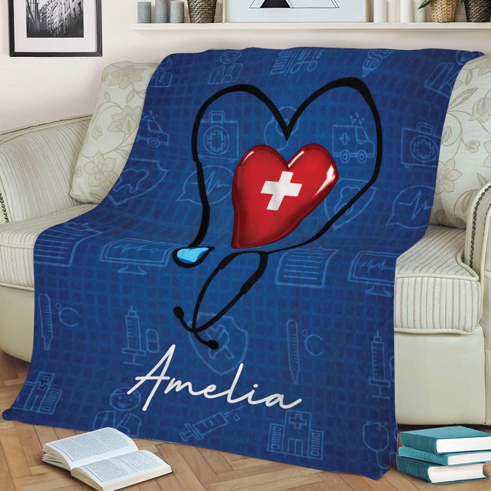 Nurse-themed couch blanket featuring a large stethoscope heart graphic and blue healthcare pattern