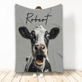 Custom cow throw blanket featuring a humorous black and white cow close-up on gray artwork