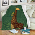 Giraffe throw blanket draped over a sofa with green grass artwork and a cozy reading setup
