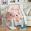 Cute pink pig throw blanket draped over a sofa in a comfortable living room