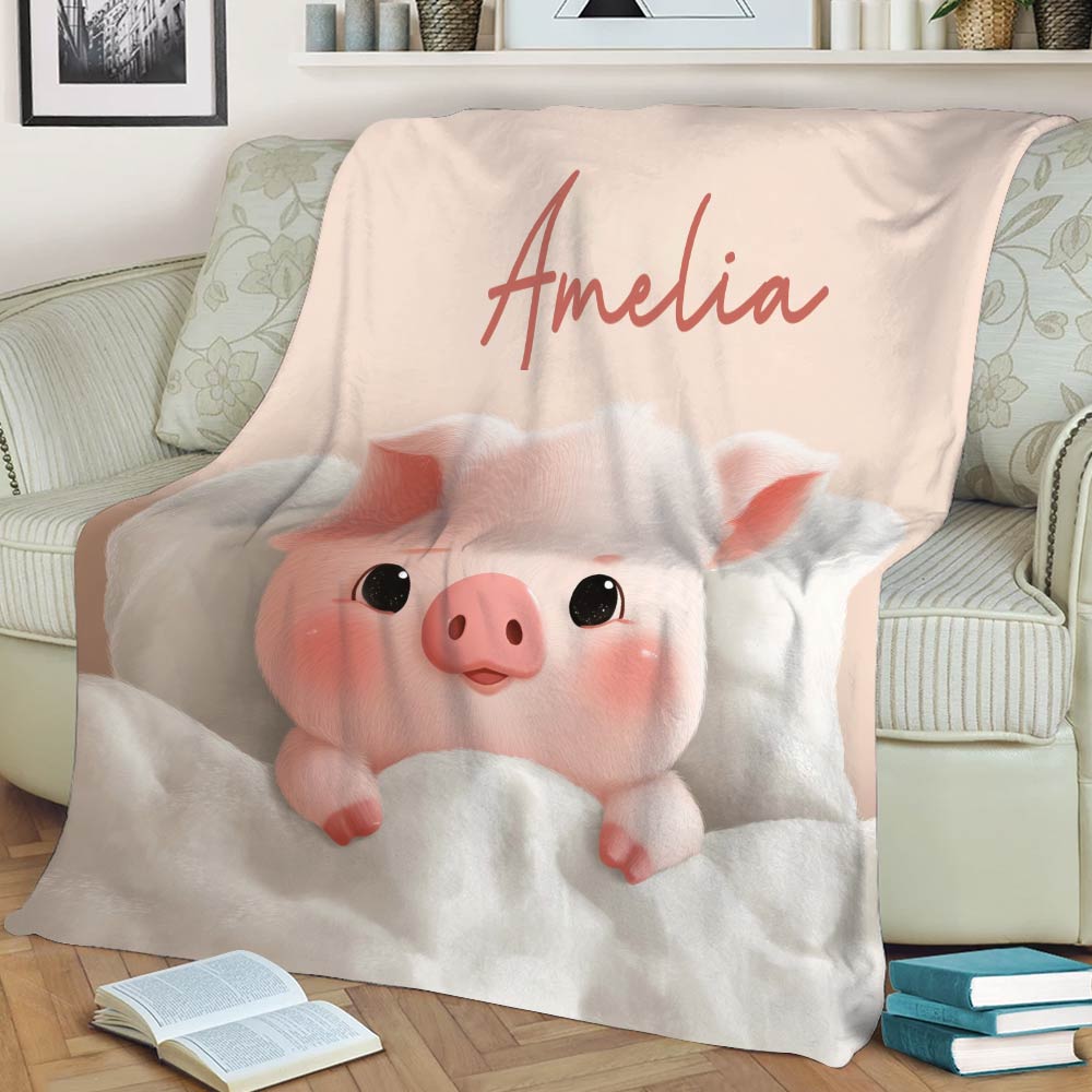 Pink pig throw blanket styled on a sofa with a soft blush background and cozy artwork
