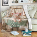 Cute pig bath scene blanket styled on a living room couch with pillows and books