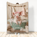 Cute pink pig with a bow relaxing in a bubbly bath on a printed blanket