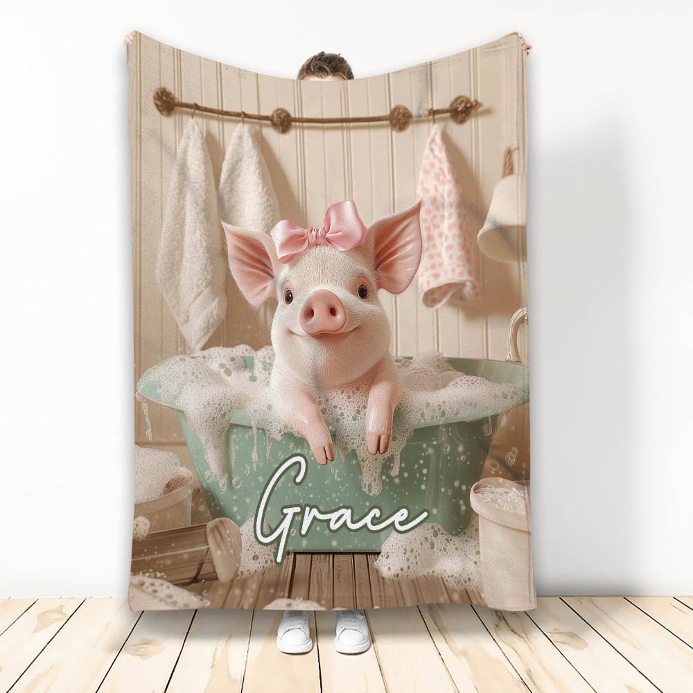 Cute pink pig with a bow relaxing in a bubbly bath on a printed blanket
