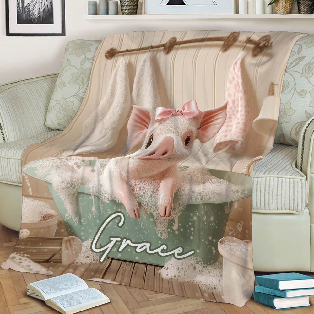 Close-up pig bath artwork blanket draped across a cozy sofa