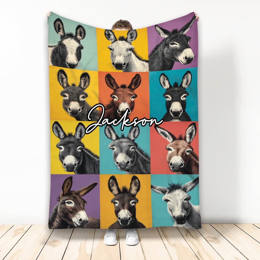 Colorful donkey collage throw blanket displayed vertically with illustrated donkey faces in vibrant panels