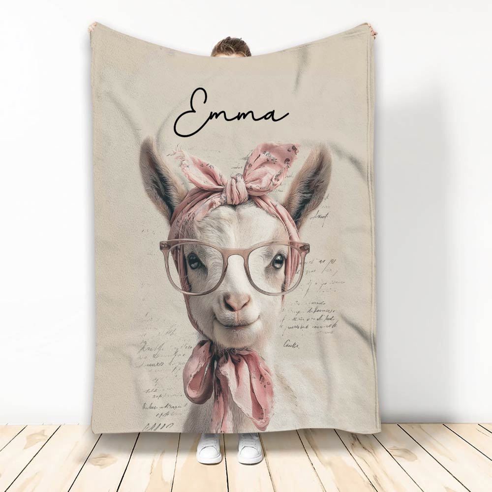 Goat throw blanket featuring a whimsical goat with glasses, pink bows, and a soft vintage-inspired palette