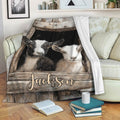 Rustic goat throw blanket draped over a sofa with farmhouse artwork