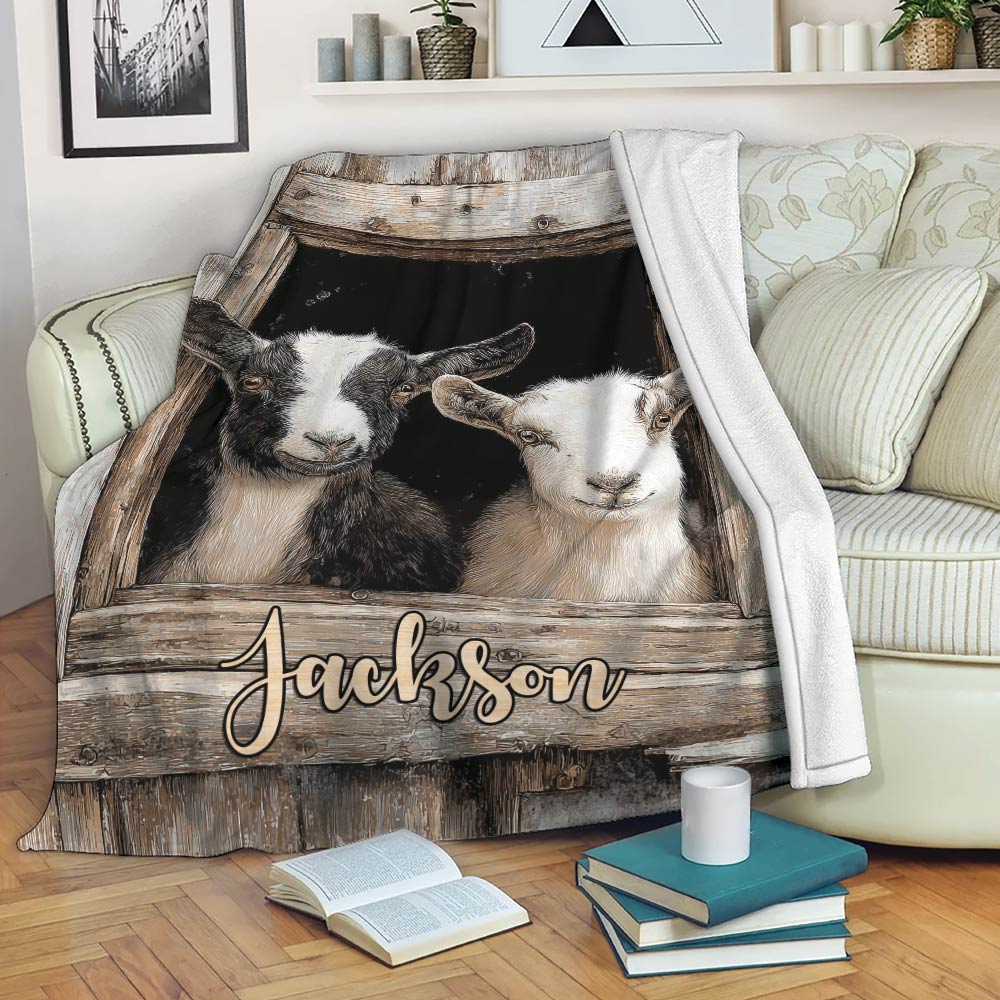 Rustic goat throw blanket draped over a sofa with farmhouse artwork