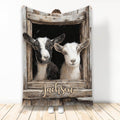 Goat throw blanket featuring two goats in a rustic wooden barn window design