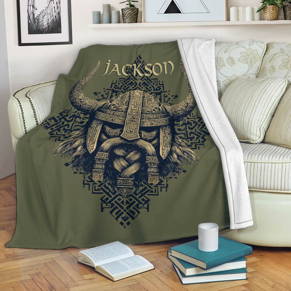 Viking blanket draped over a sofa with a detailed Norse warrior helmet and geometric knotwork design