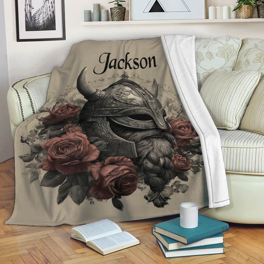 Viking blanket draped over a sofa with ornate helmet artwork, floral accents, and a cozy reading setting