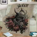 Viking throw blanket displayed on a couch with detailed Norse helmet artwork and muted red roses