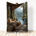Lake house throw blanket featuring a rustic cabin deck, forest lake, waterfall, and mountain landscape