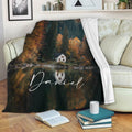 Autumn lake house blanket draped over a sofa with reflective water and forest cabin artwork