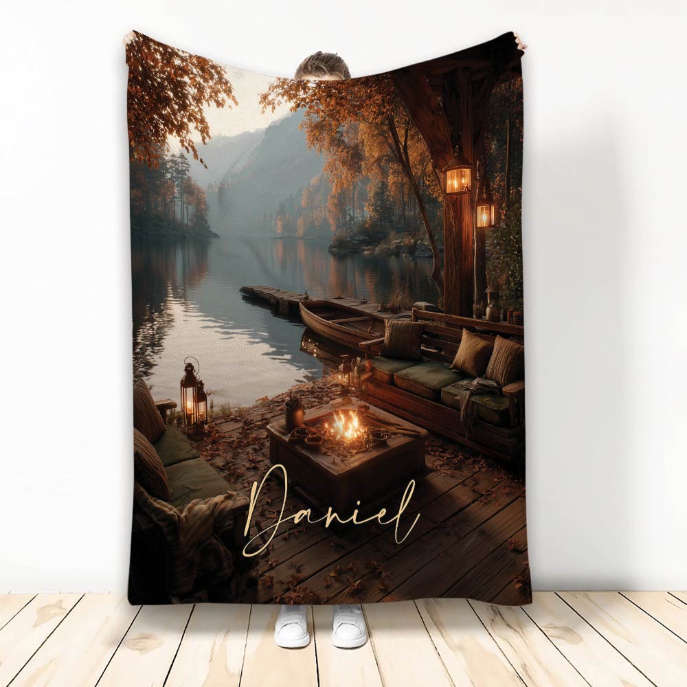 Custom Lake House Blanket featuring an autumn lake, wooden dock, rowboat, lanterns, and lakeside fire pit