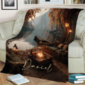 Lake House Blanket displayed on a sofa with tranquil water, forested shoreline, dock, lanterns, and fire pit