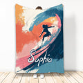 Surfing throw blanket featuring a dynamic surfer silhouette on colorful abstract waves