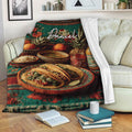 Taco blanket styled on a sofa with plated tacos, colorful food artwork, and a cozy living room setting