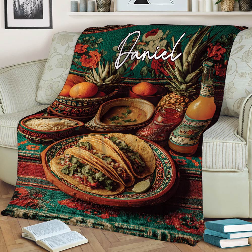 Colorful taco throw blanket draped over a sofa with plated tacos and vibrant Mexican-inspired food artwork