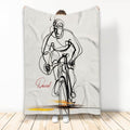 Bicycle blanket featuring bold black line art of a cyclist riding against a white background