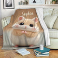 Cute hamster blanket draped over a sofa in a cozy living room setting