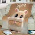 Close view of a cute hamster throw blanket styled on a living room sofa