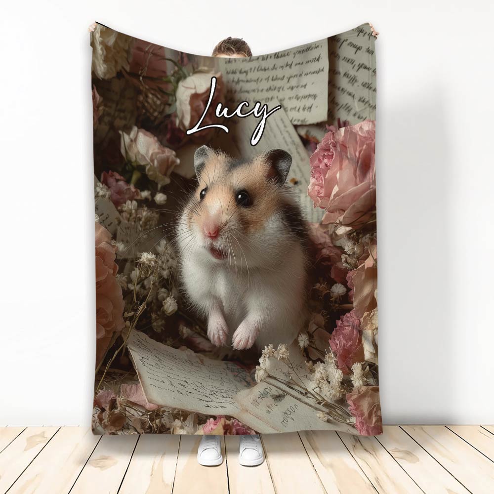 Hamster throw blanket with floral artwork, vintage papers, and a cozy decorative design