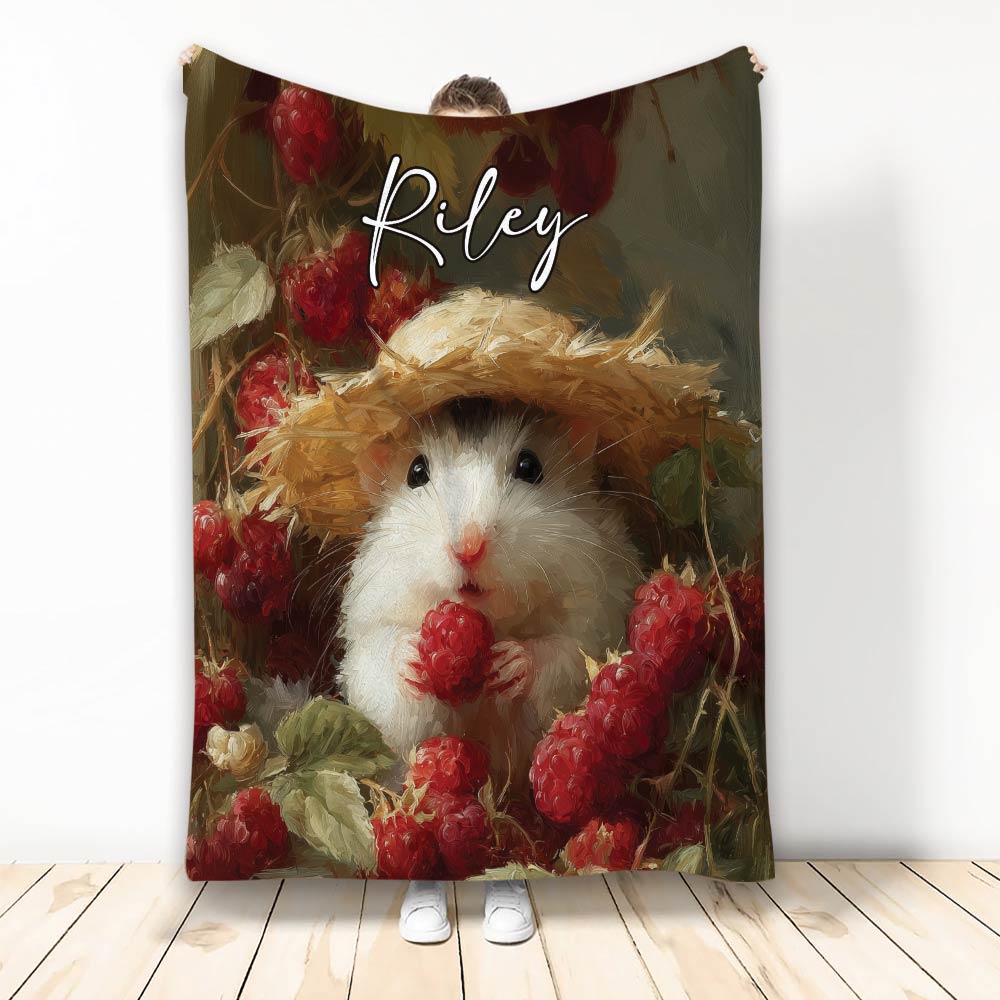 Hamster wearing a straw hat and holding a raspberry among painted berries and foliage