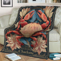 Decorative crab blanket displayed on a sofa with a large illustrated crab, botanical flowers, blue foliage, and dark vintage-style artwork