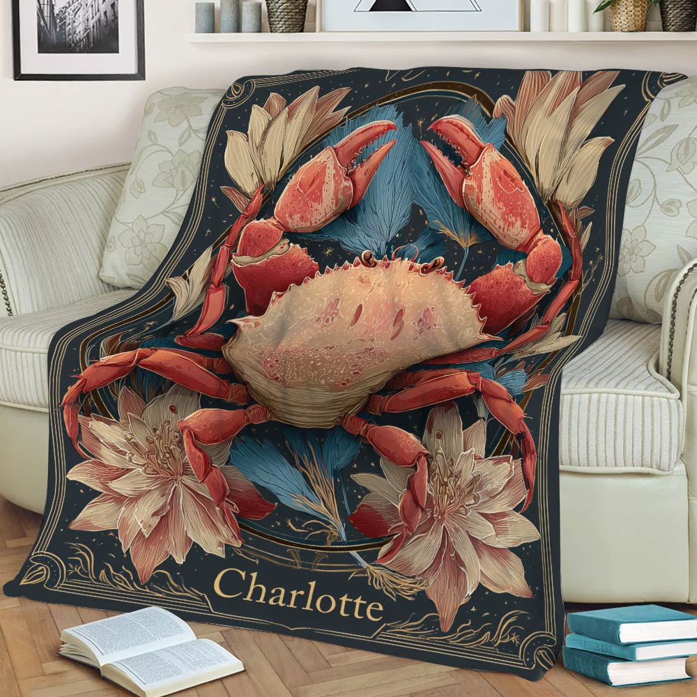 Decorative crab blanket displayed on a sofa with a large illustrated crab, botanical flowers, blue foliage, and dark vintage-style artwork