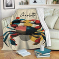 Colorful crab throw blanket draped over a sofa in a cozy living room setting