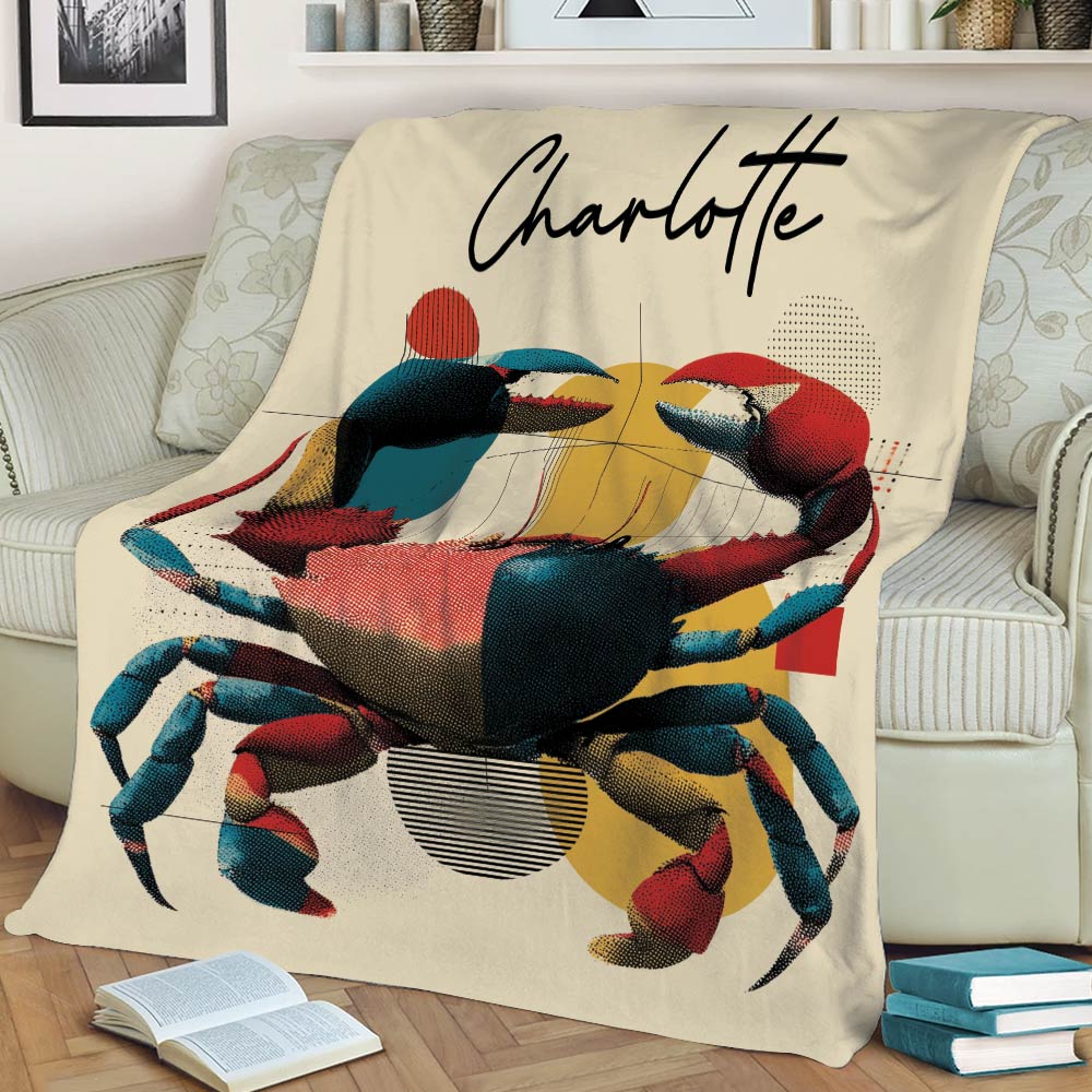 Custom crab blanket styled on a sofa with vibrant red, blue, yellow and black artwork