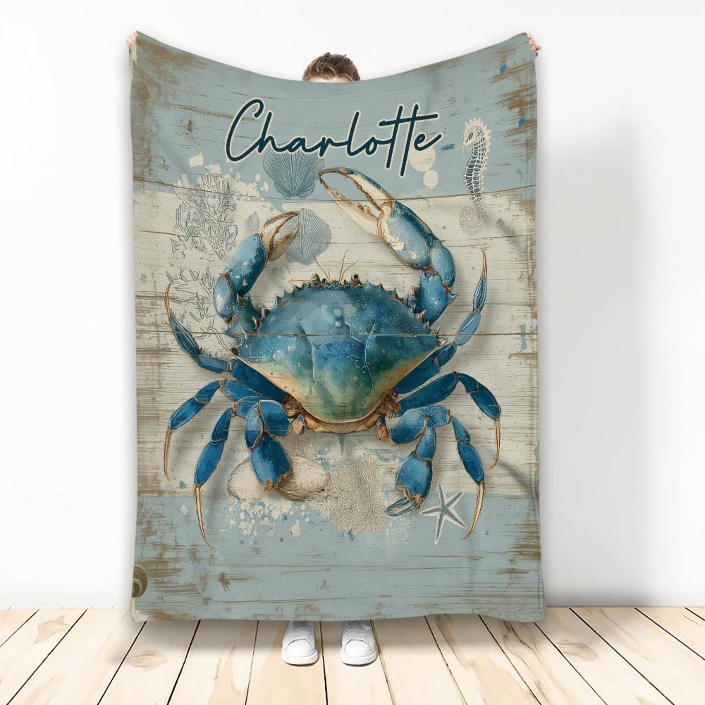 Blue crab throw blanket with coastal artwork and weathered seaside wood design