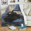 Steam locomotive railroader blanket draped over a sofa in a cozy living room